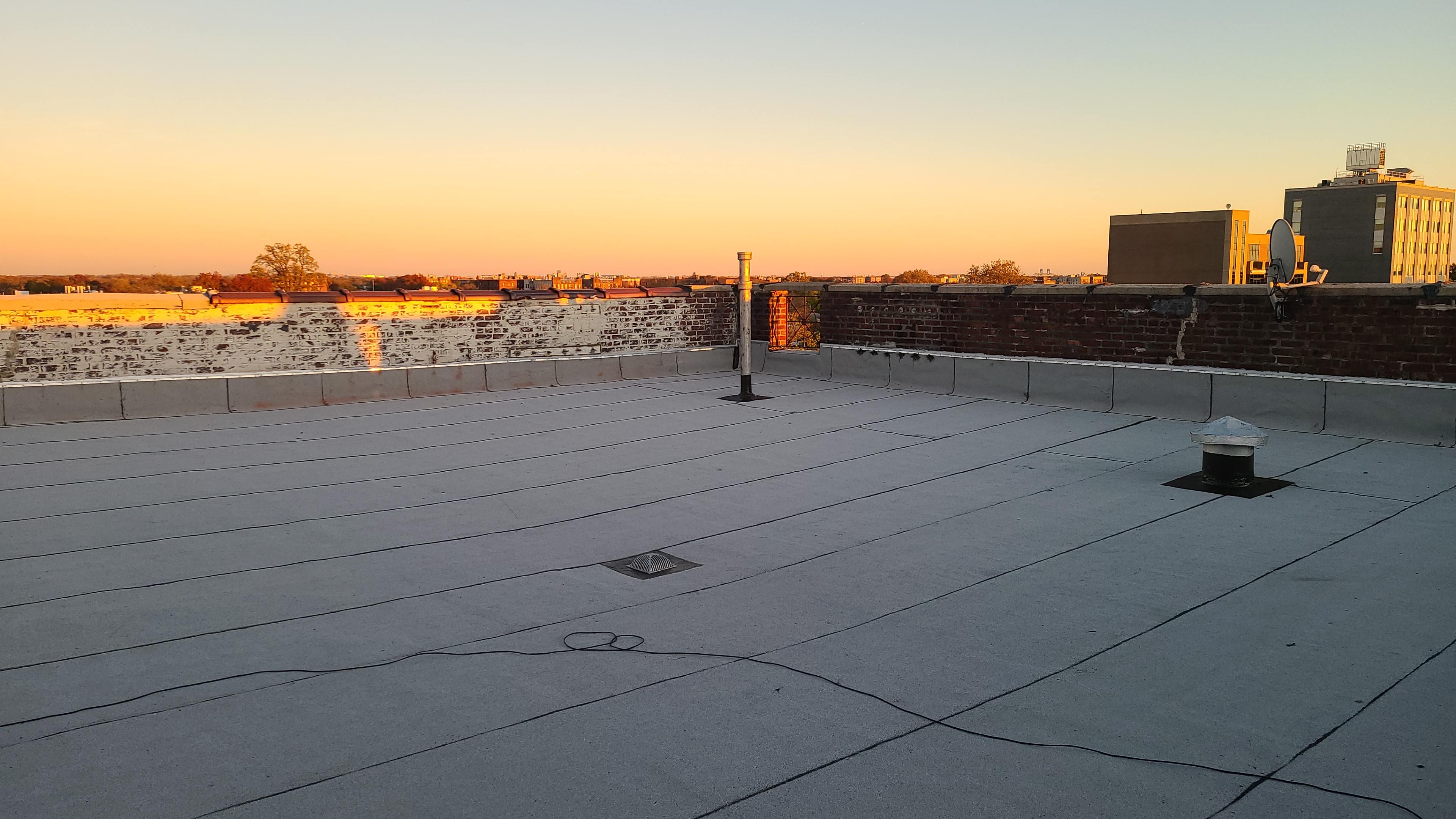 Professional roofing contractor at work in Brooklyn NYC